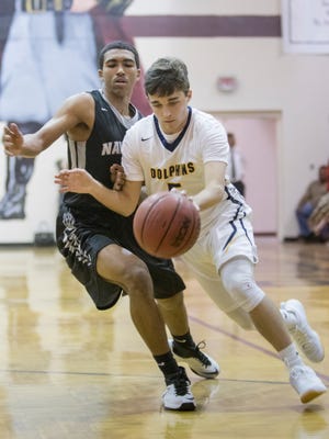 Luke McHenry dribbles into the paint for Gulf Breeze last season. Gulf Breeze announced Ryan Ottensmeyer as its new boys basketball head coach Tuesday.