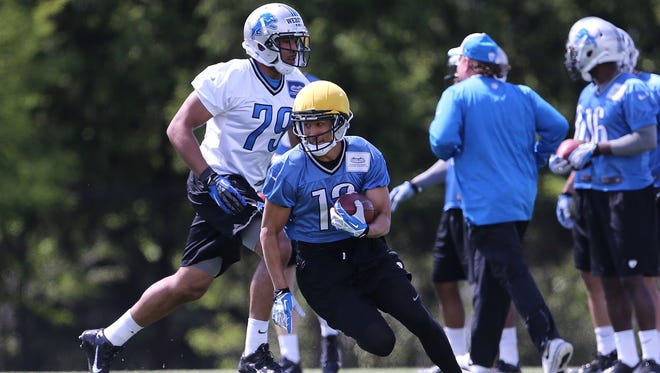 TJ Jones  of the Detroit Lions runs through the punt return drills during the Rookie Minicamp on May 17, 2014 in Allen Park, Michigan.