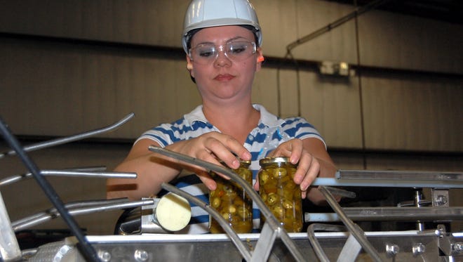 The Mizkan production line moves at a brisk pace and employees hundreds in Luna County.