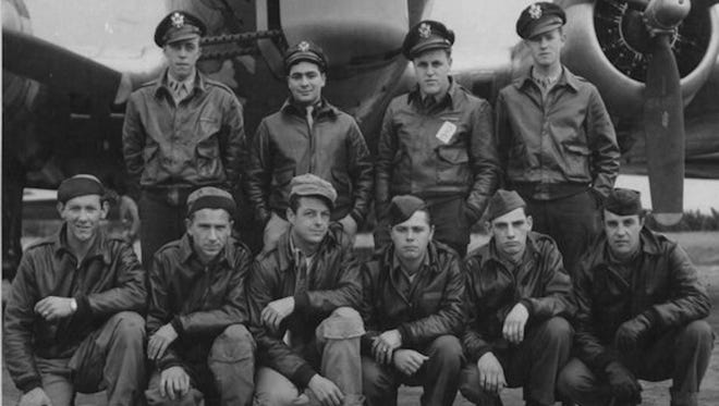 The late Karl William Carlson, front row, far left, is pictured with his his B-17 WW II bomber mates. They crashed returning from their 12th bombing mission to Germany. Carlson survived. Two members didn't. Carlson's grandchildren went to the crash site in March and later found this picture in a pub, along with a story about the crash.