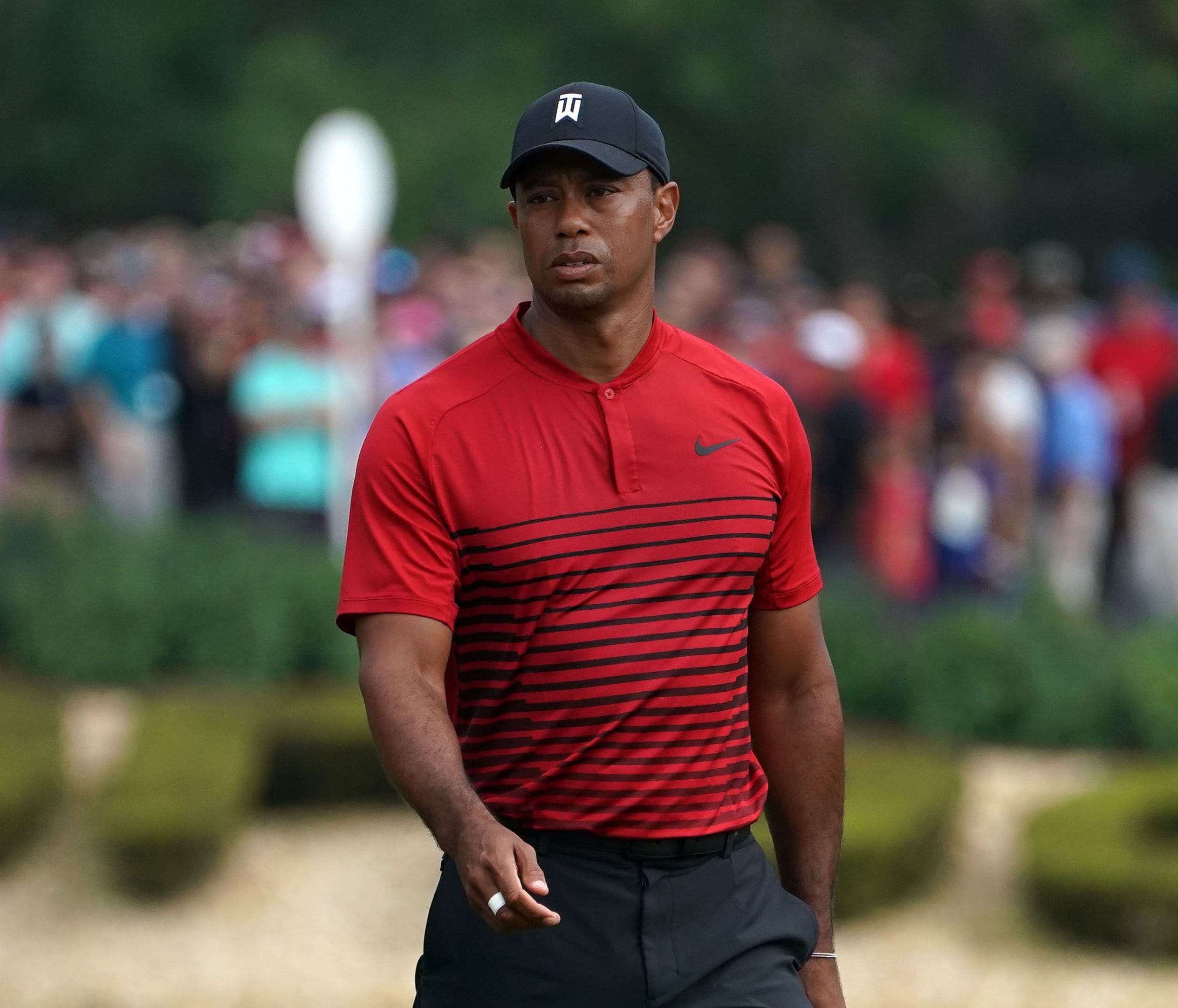Mar 11, 2018; Palm Harbor, FL, USA; Tiger Woods walks on the 14th green during the final round of the Valspar Championship golf tournament at Innisbrook Resort - Copperhead Course. Mandatory Credit: Jasen Vinlove-USA TODAY Sports