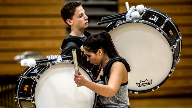 Emily Blackstone and Bobbie Lowe rehearse in the Licking Valley gym for their school's upcoming indoor percussion competition on Saturday. 
