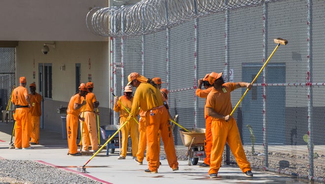 Inmates work inside the Arizona State Prison-Kingman in June 2016.
