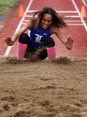 La Vergne’s Aliah Cook competes in the girls Class AAA triple jump on Thursday at Spring Fling.