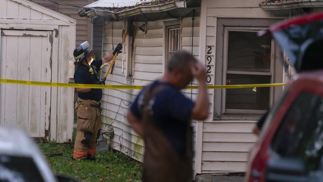 Springfield firefighters work to extinguish any remaining hot spots after a fatal fire in a single-story residence in the 2900 block of South State Street, Thursday, Aug. 27, 2020, in Springfield. Firefighters arrived on scene with smoke showing and located an unresponsive female after entering the residence. The 39-year-old female was transported to Memorial Medical Center where she succumbed to her injuries.