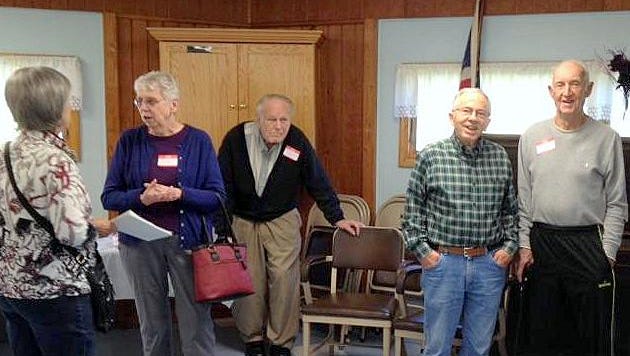 Former students of one-room schoolhouses in the Town of Southport enjoy a recent reunion hosted by the town's historical society.