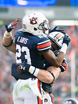Auburn wide receiver Ryan Davis (23) celebrates scoring a touchdown with Auburn wide receiver Will Hastings (33) touchdown during the NCAA football game between Auburn and Mississippi State on Saturday, Sept. 30, 2017 in Auburn, Ala. 