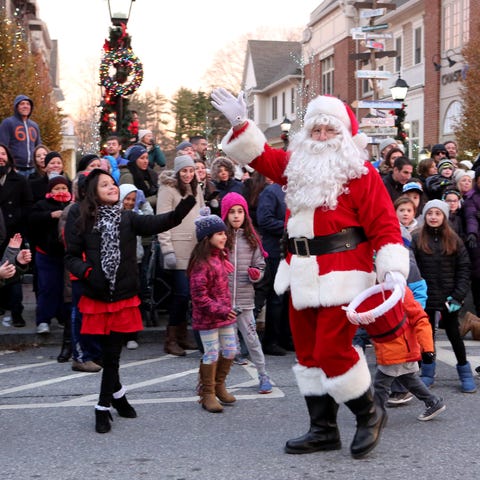 Santa Claus marches in the parade during Frosty Da
