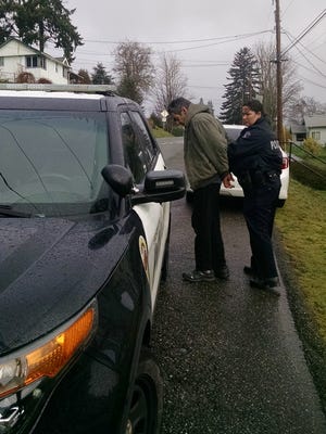 Bremerton Police Officer Sara Felty arrests Richard R. Heller on Wednesday morning.