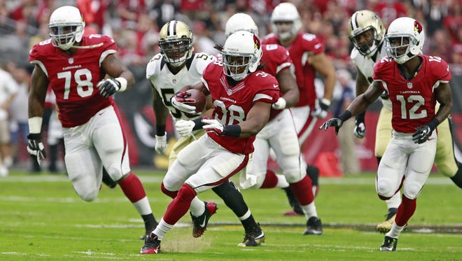 Arizona Cardinals running back Andre Ellington (38) picks up a first down on the Cards opening drive against the  New Orleans Saints in the 1st quarter of  their NFL game  Sunday, Sept. 13, 2015 in Glendale, Ariz.