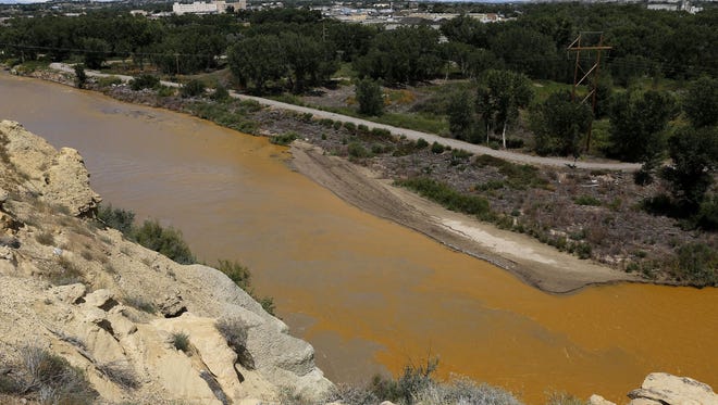 Water from the Animas River mixes with the San Juan River on Aug. 8, 2015, shortly after the Gold King Mine spill.