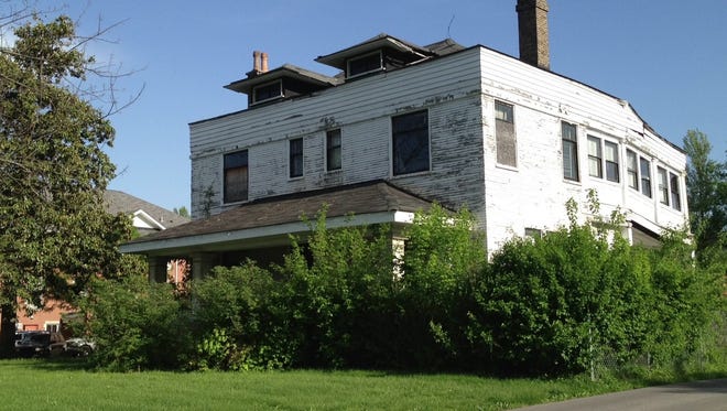 The Peter C. Doerhoefer House, 4422 W. Broadway, is shown in 2014 after being vacant for years.
