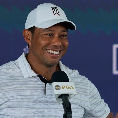 Tiger Woods speaks during a news conference at the