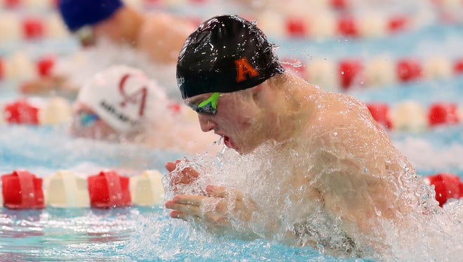 Ashland's Hudson McDaniel en route to a repeat title in the 100-yard breaststroke at the state swim meet.