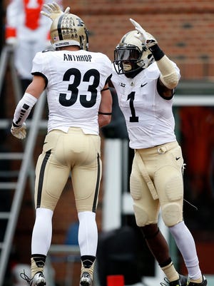 Purdue running back Akeem Hunt (1) celebrates his touchdown against Illinois with wide receiver Danny Anthrop (33) during the first half of an NCAA football game on Saturday, Oct. 4, 2014, in Champaign, Ill. (AP Photo/Andrew A. Nelles)