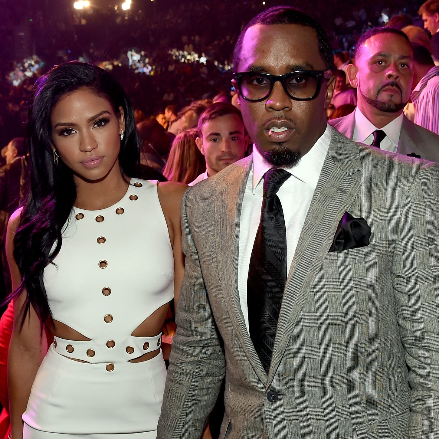 Sean "Diddy" Combs poses ringside with model Cassie Ventura.