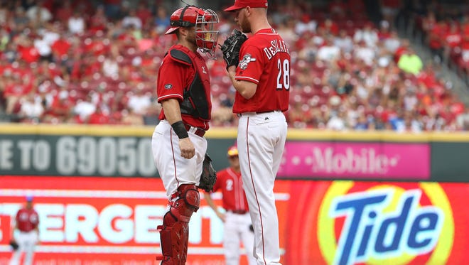 Cincinnati Reds catcher Tucker Barnhart (16) and starting pitcher Anthony DeSclafani (28) during the 7th inning against the San Diego Padres at Great American Ball Park Sunday, June 26, 2016. DeSclafani pitched through the 8th inning. The Reds won 3-0.