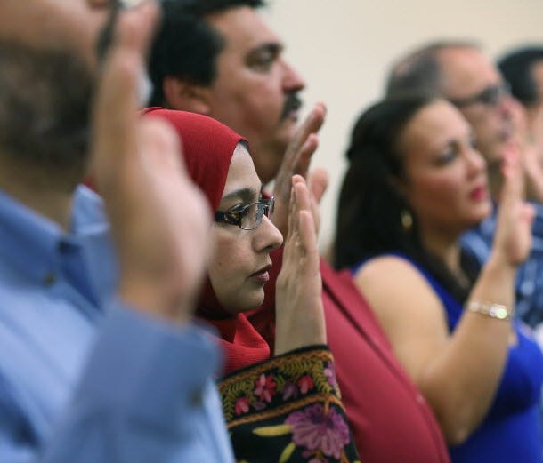Indian immigrant at a naturalization ceremony in Florida on February 14, 2013.