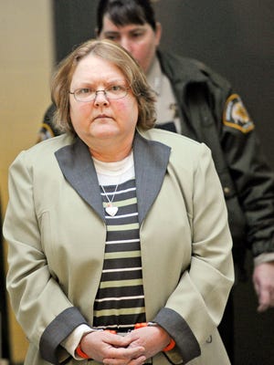 Joyce Hardin Garrard walks to the Etowah County Judicial Building from the Etowah County Detention Center in Gadsden, Ala. on Monday March 9, 2015.   A jury is ready to hear opening statements in the capital murder trial of Garrard, accused of making her granddaughter run until she died. Prosecutors say the 49-year-old forced Savannah Hardin, 9,  to run for hours as punishment for a lie about eating candy. (AP Photo/The Gadsden Times, Eric T. Wright)