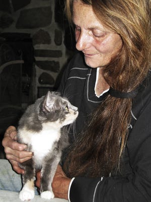 Linda Reichel, owner of A Voice For All Animals/Second Chance Ranch, shown here with rescued cat Zoe, will host a benefit Oct. 23 at the Green Derby in Elmira.