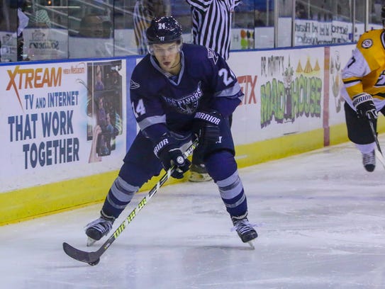 Pensacola's Stephen Hrehoriak (24) looks to pass the