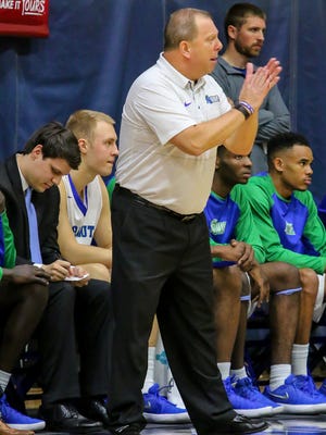 UWF head coach Jeff Burkhamer cheers on his team against Montevallo during a Gulf South Conference Tournament game at the University of West Florida Field House on Tuesday, Feb. 27, 2018. Seeded number two, UWF beat #7 Montavello 83-74.