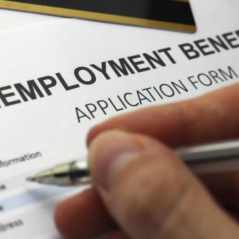 A file photo of a person filling out an unemployme