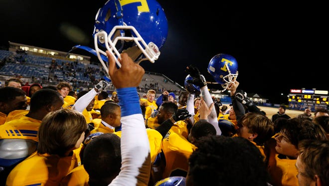 Tupelo High School football players celebrates their 12-3 win over South Panola in the North Half State Championship game Friday night.