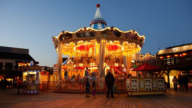 The San Francisco Carousel on Fisherman's Wharf features hand-painted local landmarks like the Golden Gate Bridge, Alcatraz and Chinatown, and shines with 1,800 LED lights.