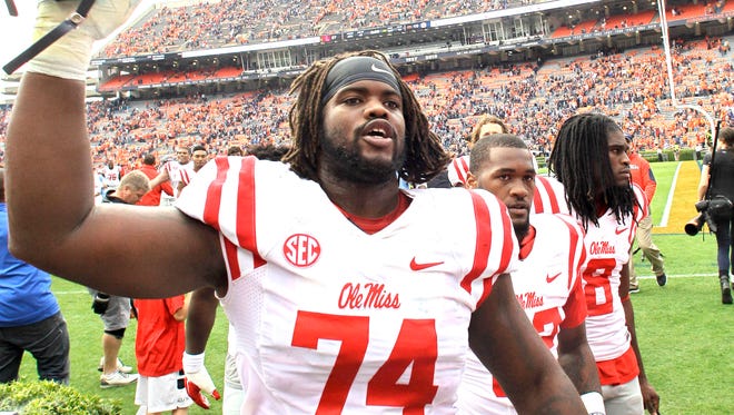 Former Ole Miss offensive tackle Fahn Cooper celebrates after the Rebels' win against Auburn last year. He was drafted in the fifth round by the San Francisco 49ers on Saturday, his 23rd birthday.