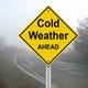 A sign reading "Cold Weather AHEAD."