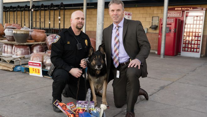 K9 Thor poses with officer Josh New and Abilene Police Department chief Stan Standridge outside of Abilene's H-E-B. The grocery provided $15,000 to bring Thor to Abilene.