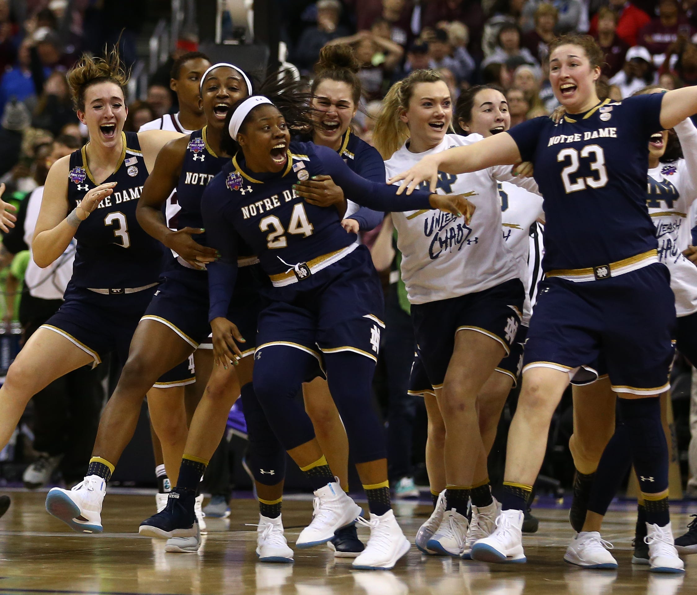 Notre Dame's Arike Ogunbowale celebrates with teammates after making the game-winning three-pointer against Mississippi State in the women's college basketball national championship at Nationwide Arena in Columbus, Ohio.