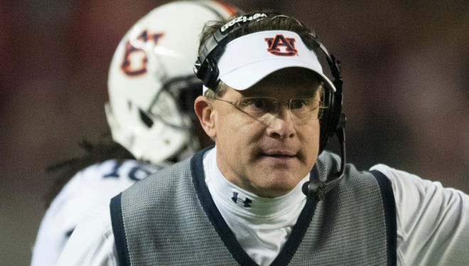 Auburn coach Gus Malzahn argues with a referee during the Iron Bowl at Bryant-Denny Stadium in Tuscaloosa, Ala., on Saturday, Nov. 29, 2014.