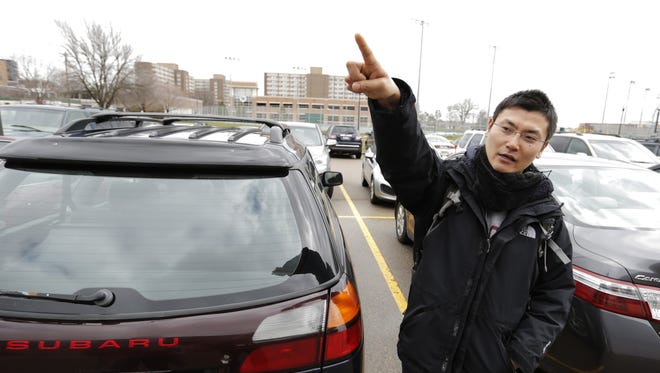UW-Oshkosh student Ari Imaizumi talks about the parking issues at UW-Oshkosh on April 6, 2016. The college has fewer parking spaces than it did 10 years ago.