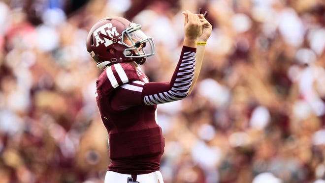 Johnny Manziel did not incur a penalty for his "show-me-the-money" hand gesture in celebration of his first touchdown pass Saturday, but his reaction to his final TD pass had two consequences: a 15-yard penalty, and a bench from Texas A&M coach Kevin Sumlin.