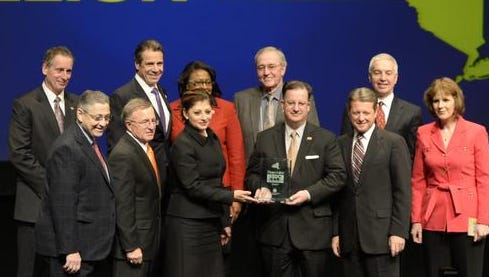 Representatives of the Finger Lakes Regional Development Council accept a $59.8 million award from Gov. Andrew Cuomo in Albany on Wednesday.