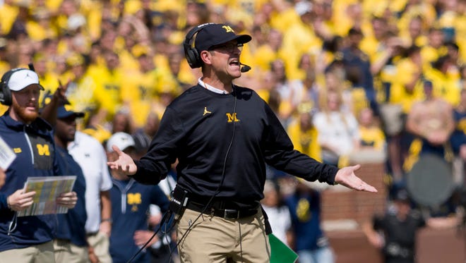 Michigan coach Jim Harbaugh is 1-4 against Michigan State and Ohio State.