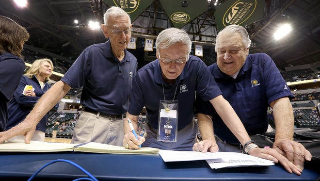 Indiana Pacers scorekeeper Bob Bernath,left, Bill Bevan, and Bill York,statistics crew director, right, get ready for the Pacers game against the Oklahoma City Thunder.
