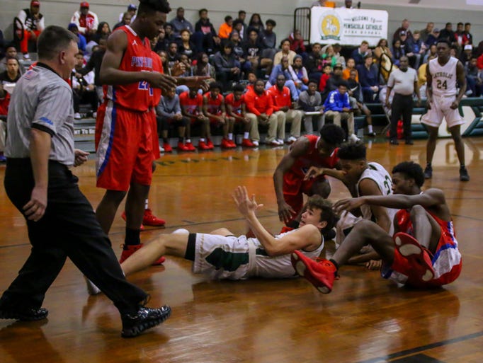 Players scramble to get possession of the ball in the