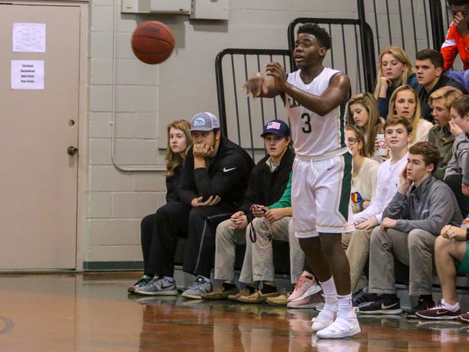 Catholic's Jakobi Jackson (3) passes the ball against