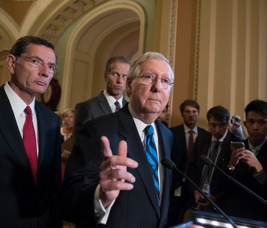 Mitch McConnell meets with reporters after a closed-door Republican strategy session.