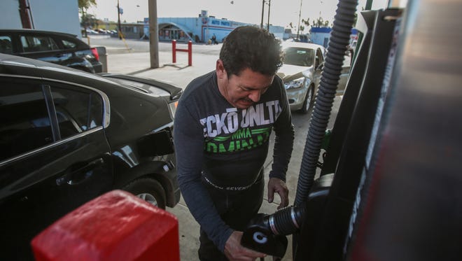 Juan Romero Guiterrez, 48, of Mexicali, Mexico fills his gas tank at the FillCo gas station in the border town of  Calexico, California on Wednesday, January 11, 2017. A gas price hike and protests against the hike has made supplies unreliable in Mexicali for the past several days.