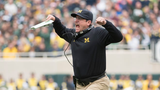 Michigan head coach Jim Harbaugh yells at the officials in the second quarter.