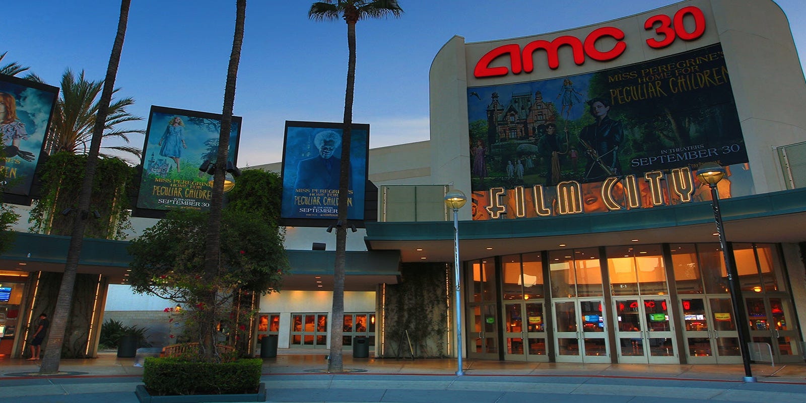 AMC stock surges after movie theater chain raises $428 ...