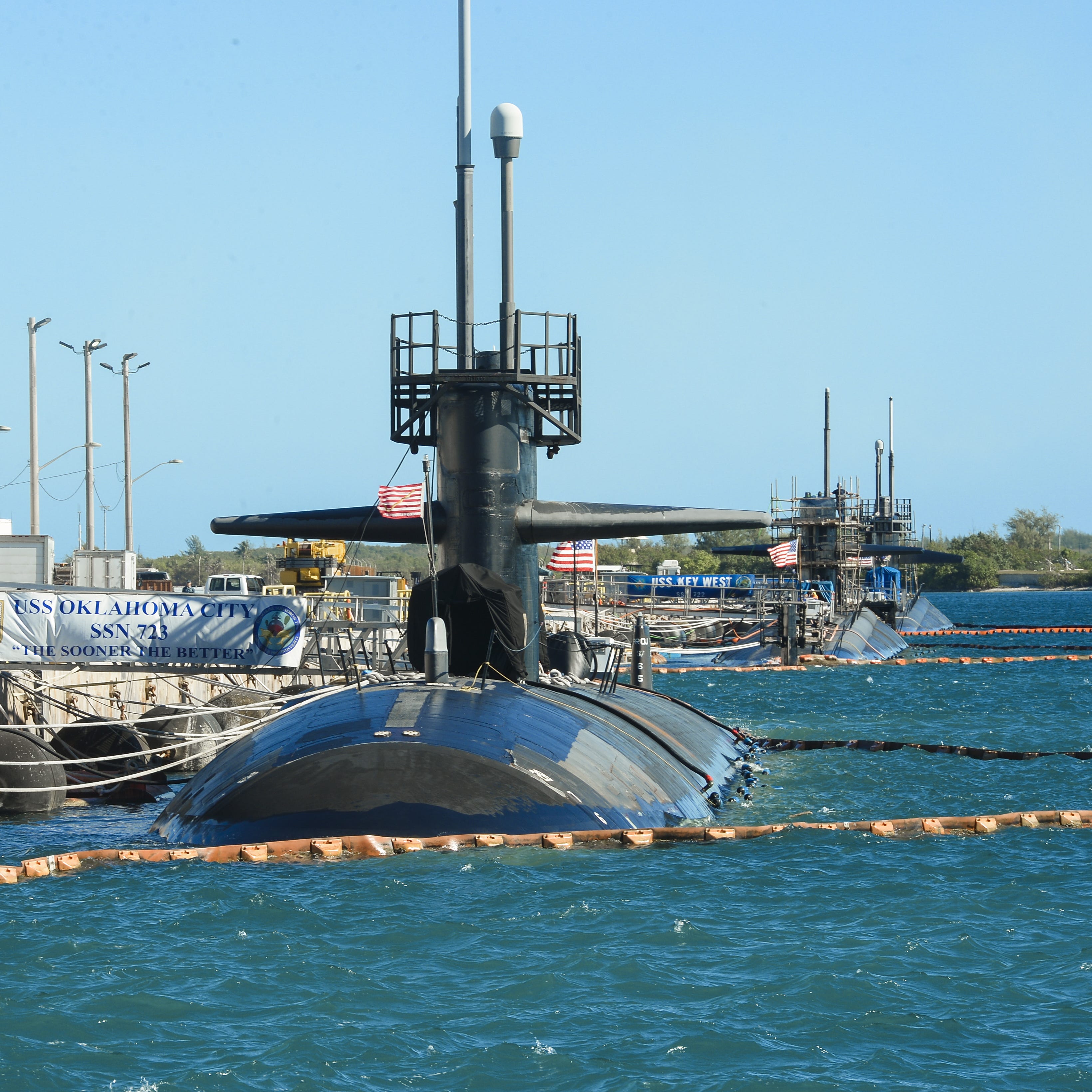 U.S. Navy fast-attack submarines, from left, U.S.S. Oklahoma City, U.S.S. Key West and the U.S.S. Chicago can be seen docked at Naval Base Guam on Jan. 11, 2016.