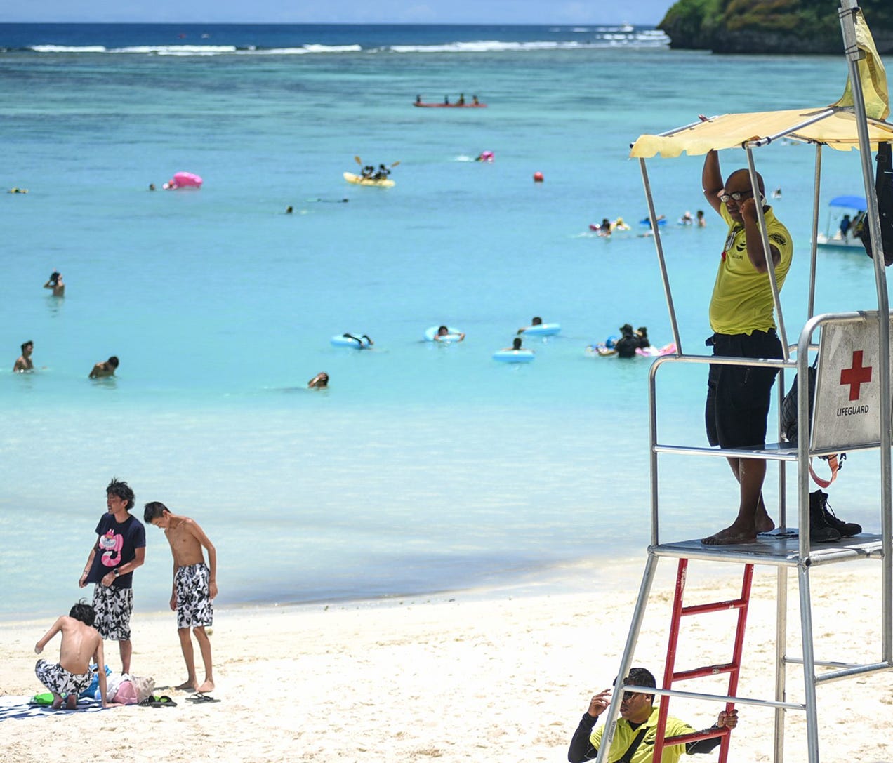 Visitor Safety Officer Fletcher Persinger looks out to the beach in Tumon, Guam, near the Outrigger Guam Resort on Aug. 9, 2017. Despite recent tensions between the U.S. and North Korea, tourism with South Korea was up 5% over the weekend ended Sunda