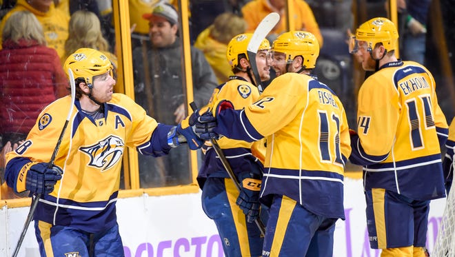 The Nashville Predators congratulate each other after scoring in the third period against the Anaheim Duck at the Bridgestone Arena on Saturday, Nov. 12, 2016,  in Nashville, Tenn. The Predators defeated the Ducks 5-0. 