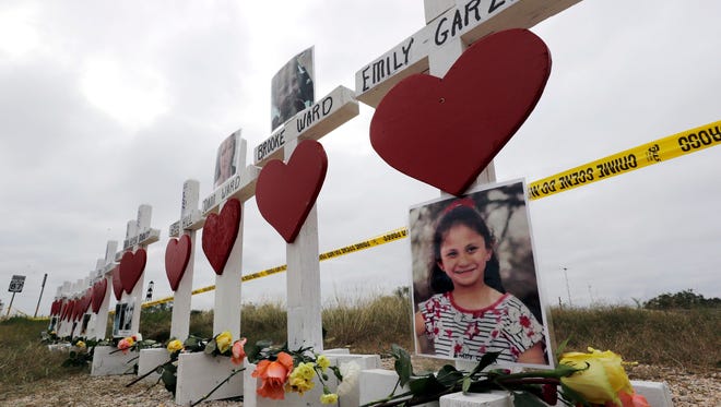 Crosses showing shooting victims names stand near the First Baptist Church on Nov. 9, 2017, in Sutherland Springs, Texas. 