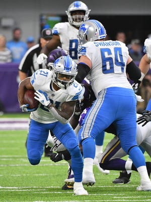 Lions running back Ameer Abdullah works up field in the second quarter Sunday against the Vikings.